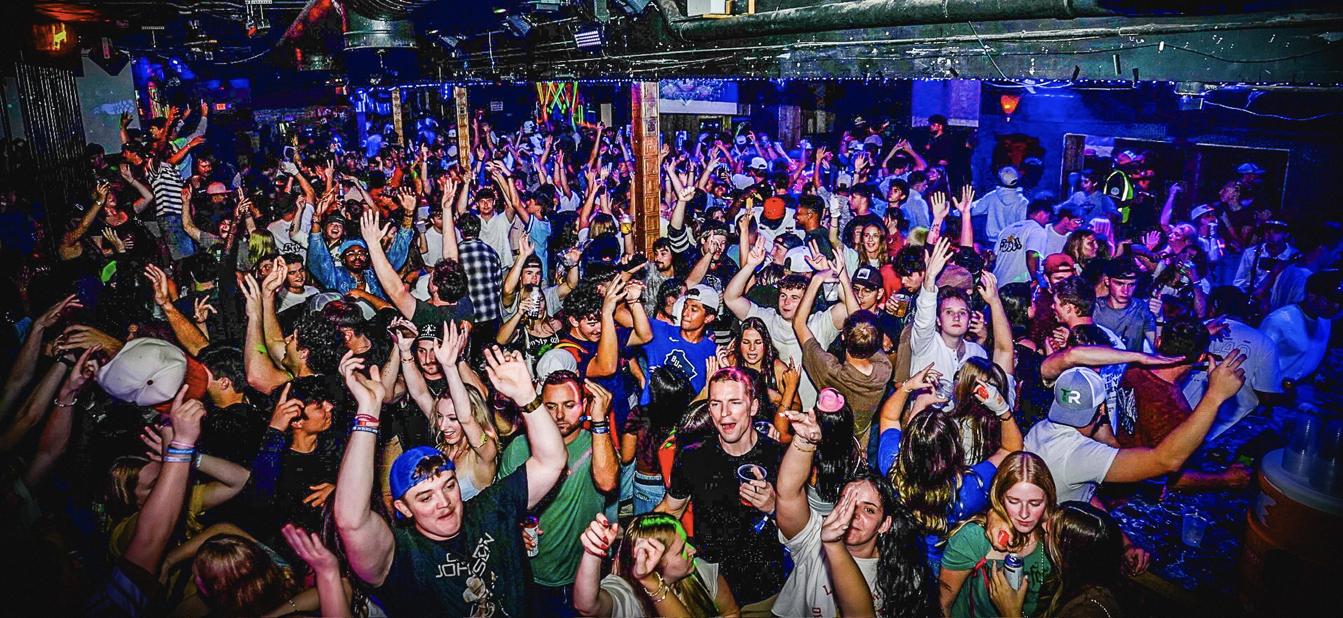Large excited crowd at nightlife event