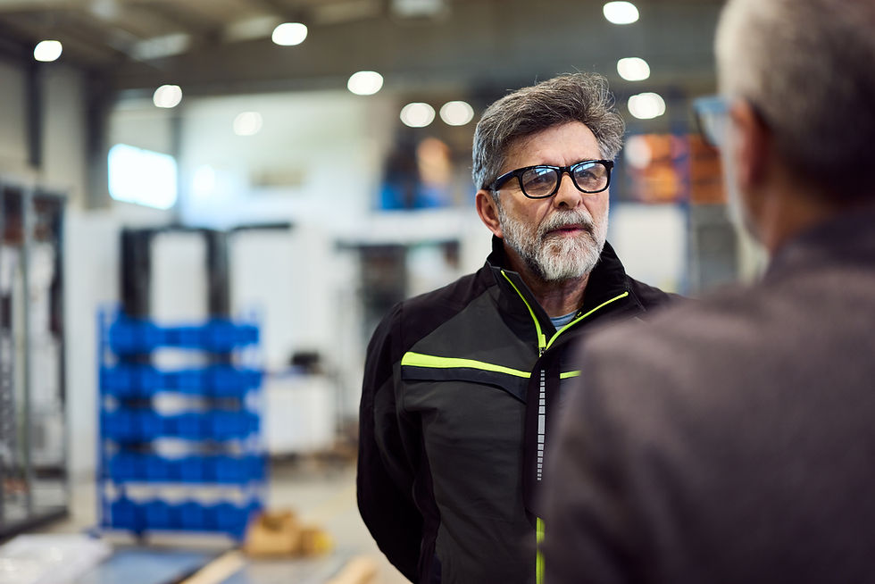 Conversation-Between-Professionals-in-a-Modern-Industrial-Workspace-2217345094_2123x1416.j