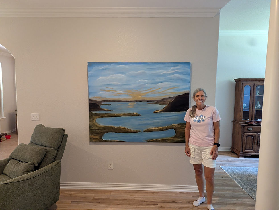 Kelly standing beside the artwork she commissioned from Trish Whitsell. A Guide to Ordering Custom Artwork
