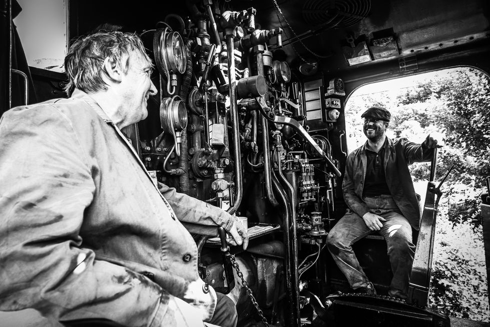 Black and white photo of steam engine crew  
