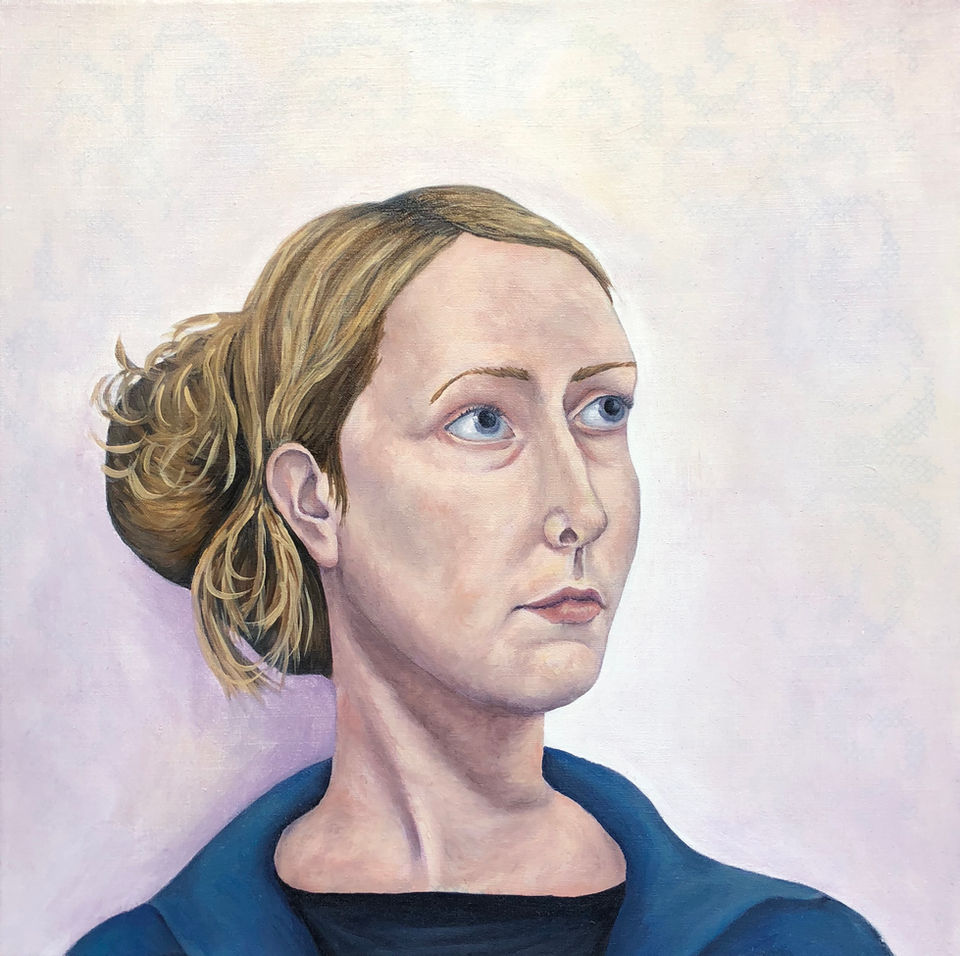 Head and shoulder portrait of a young women looking up to her left.