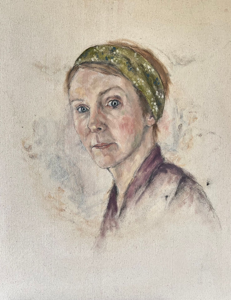 A portrait of a women with her head turned to the viewer, wearing a green headscarf. The image is fading away.