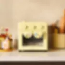 Yellow Our Place Wonder Oven on a kitchen counter
