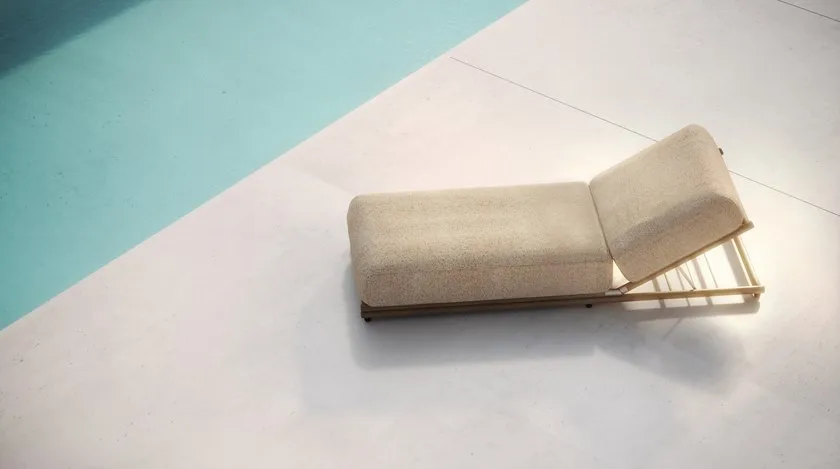 Posh gold and plush cushioning sun lounger chair