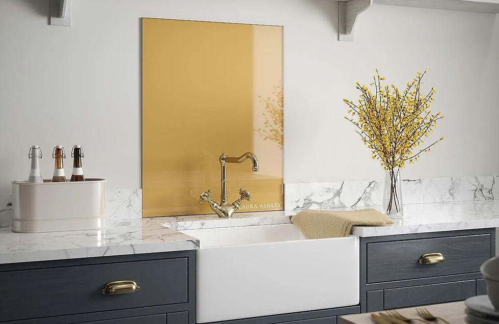 Brass splashback in a grey kitchen