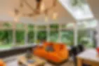 Conservatory with natural light and cosy chandelier