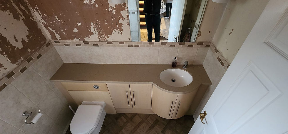Old bathroom before refit with a curved vanity unit