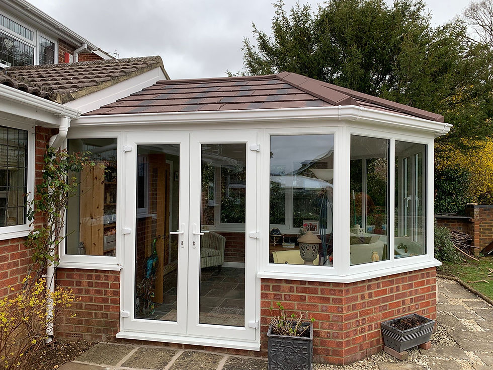Well-maintained conservatory with a tiled warm roof, built to last 25 years or more