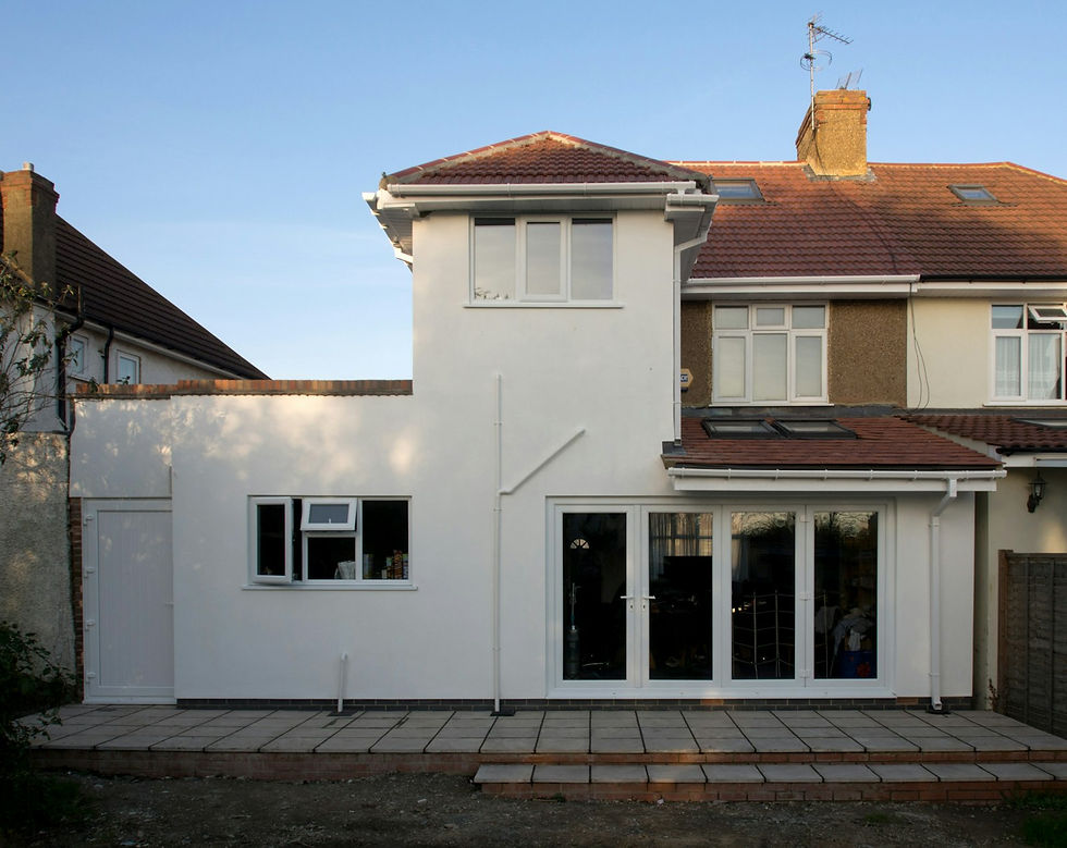 Rendered flat-roof rear extension with French doors on a semi-detached house
