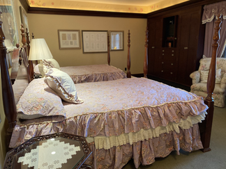 King's Daughters Room featuring two queen beds and ruffled duvets.