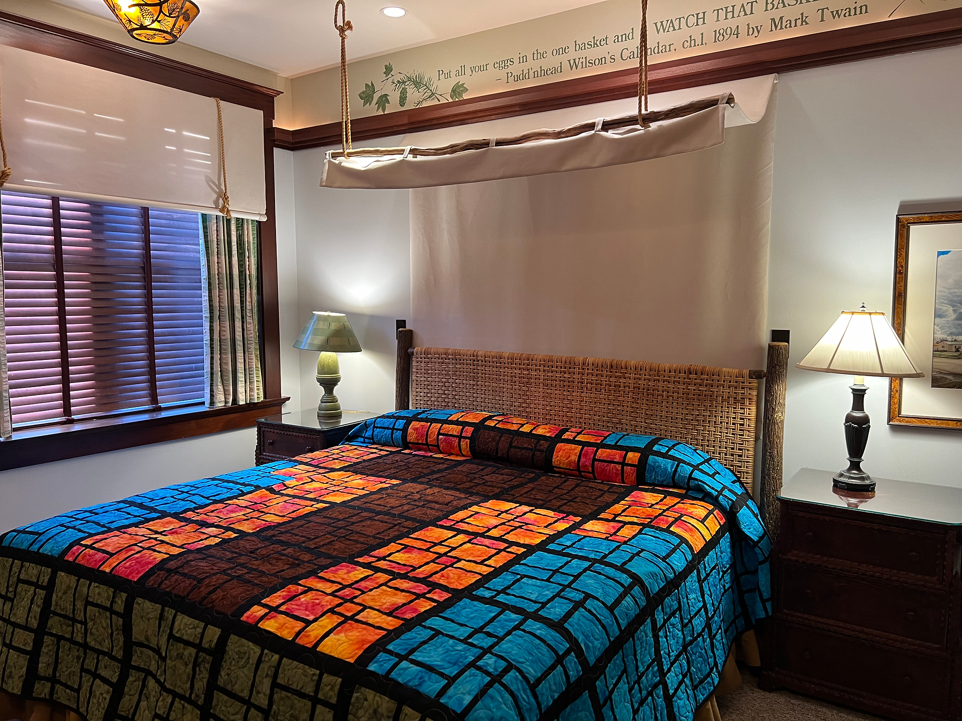 Bright, vibrant colors in a stained glass layout of the Chautauqua Room quilt