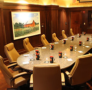 Dallas County Boardroom set for a business meeting with rolling, leather chairs and a marble table