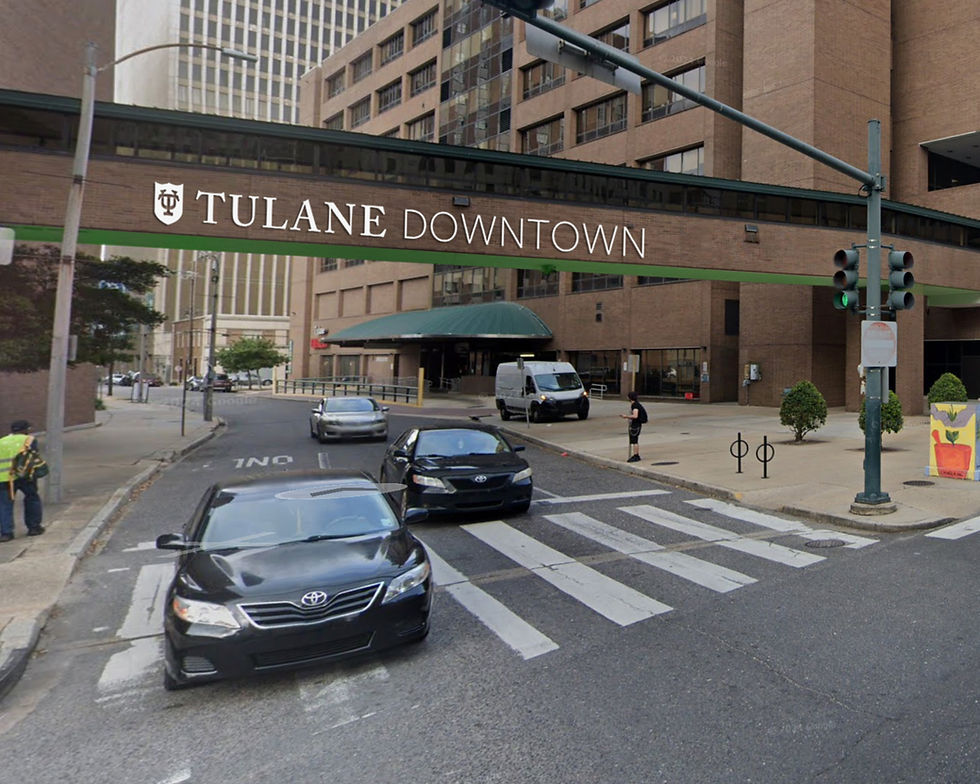 overhead walkway between two buildings with Tulane Downtown sign on it