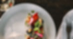 White plate with roasted beetrrot, nuts and garnish