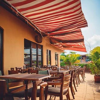 A picture of restaurant with patio awnin