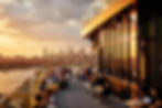 The sun sets over teh Manhattan skyline as seen from the rooftop of the William Vale, an Eco Hotel in Brooklyn