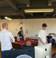 Image of the Team playing Pool
