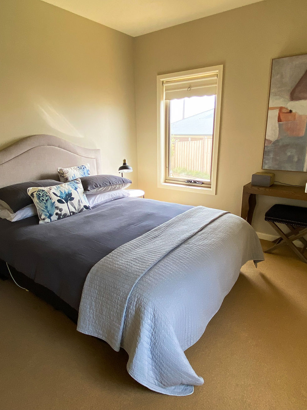 client home away from home with a bed and side tables