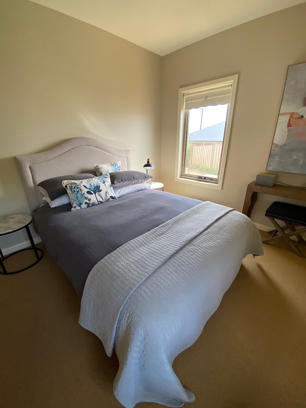 client home away from home with a bed and side tables