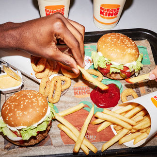 hand reaching food on a table-Burger King