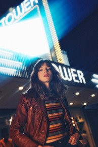 Available light street photography Miami — Candelaria under streetlight, Little Havana