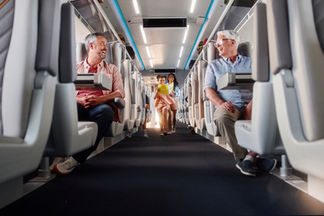 Miami lifestyle photography of family enjoying Brightline train ride in authentic real-life moment
