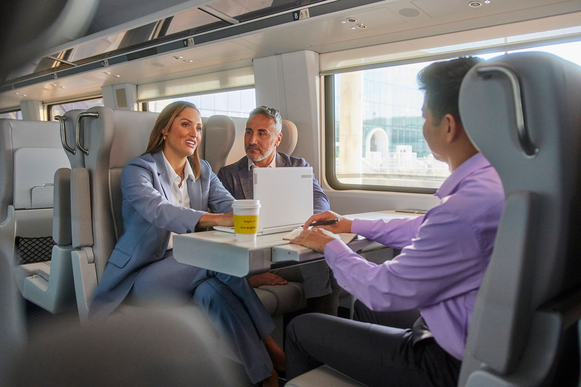 coworkers having a meeting on train
