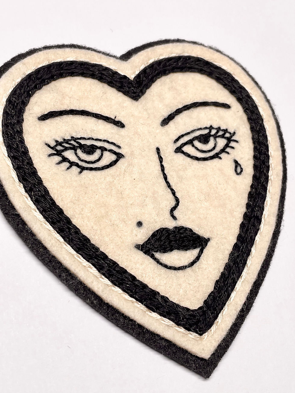 Thumbnail: Black lines lady face heart patch