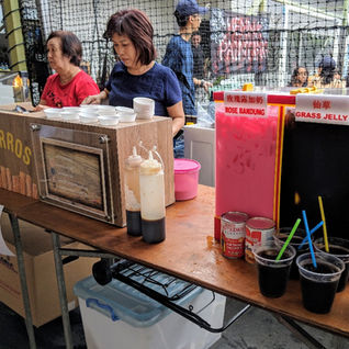 Carnival food stall rental Singapore staff serving drinks at birthday party or corporate event