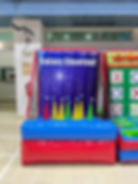 A colorful inflatable galaxy shoot-out setup with glowing stars and planets, designed for fun and easy gameplay