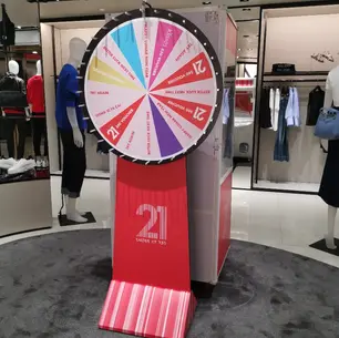 Spin wheel rental for retail store activation – custom branded wheel set up inside fashion boutique, Singapore