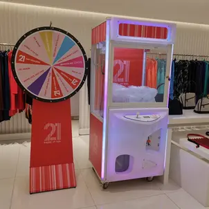 Spin wheel rental paired with claw machine for retail promotion event