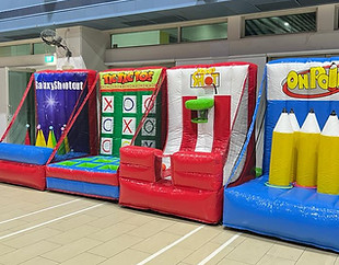 Large inflatable soccer dart and axe throwing carnival games