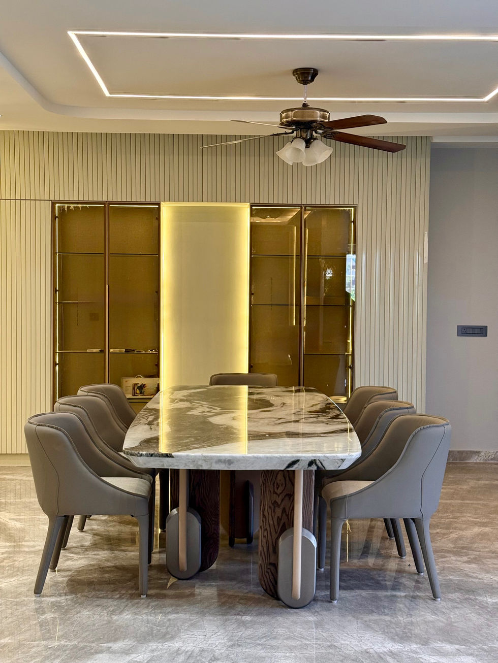 Elegant dining room with marble table and modern chairs.