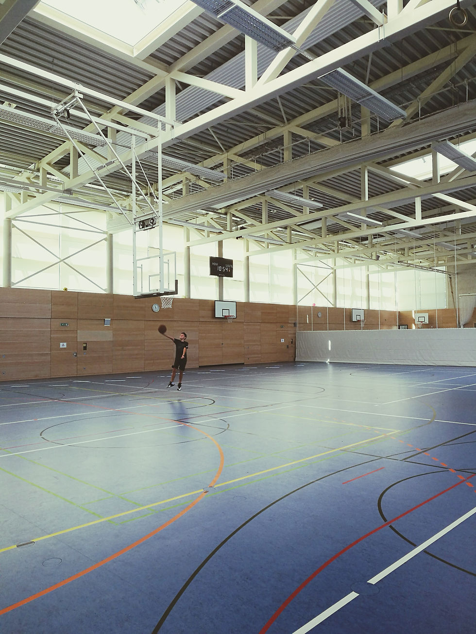 low-angle-view-basketball-hoop-against-building