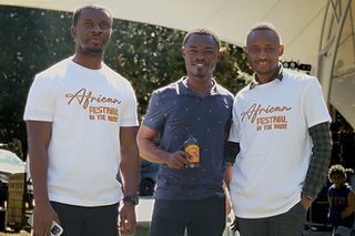 Festival volunteers in event T-shirts at the Africa in the Park festival in Canberra