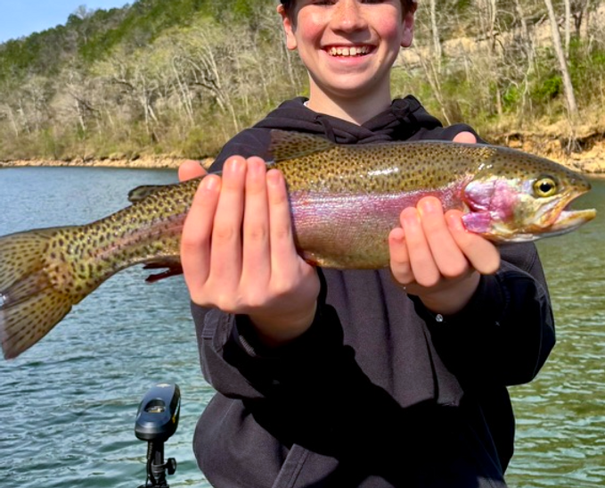 Angler holding a rainbow trout