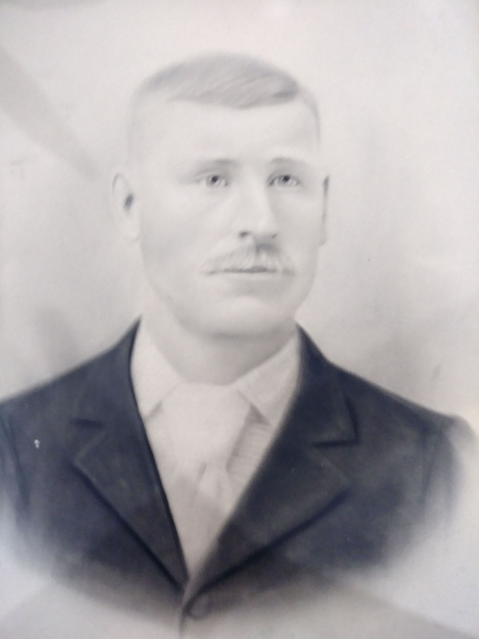 A younger man posing
