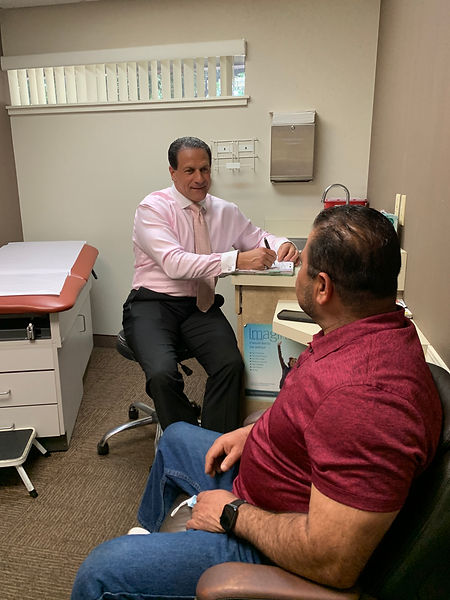 Dr. Allende discussing wellness plan with patient