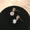Thumbnail: Silvertone Round CZ Drop Earrings