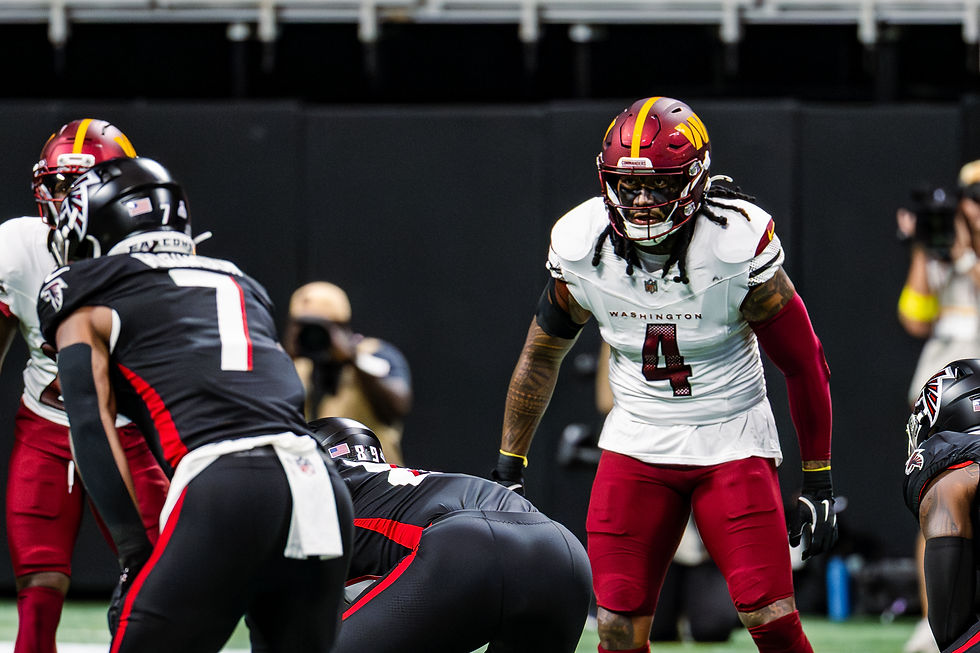 Bijan Robinson carrying the ball in Atlanta Falcons No. 7 against Washington on September 28, 2025, displayed in a responsive 16:9 cover crop.