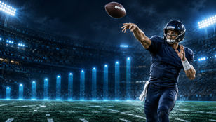 Original Football Nation illustration of a quarterback surveying a defense under stadium lights, with a Week 1 fantasy ranking motif.