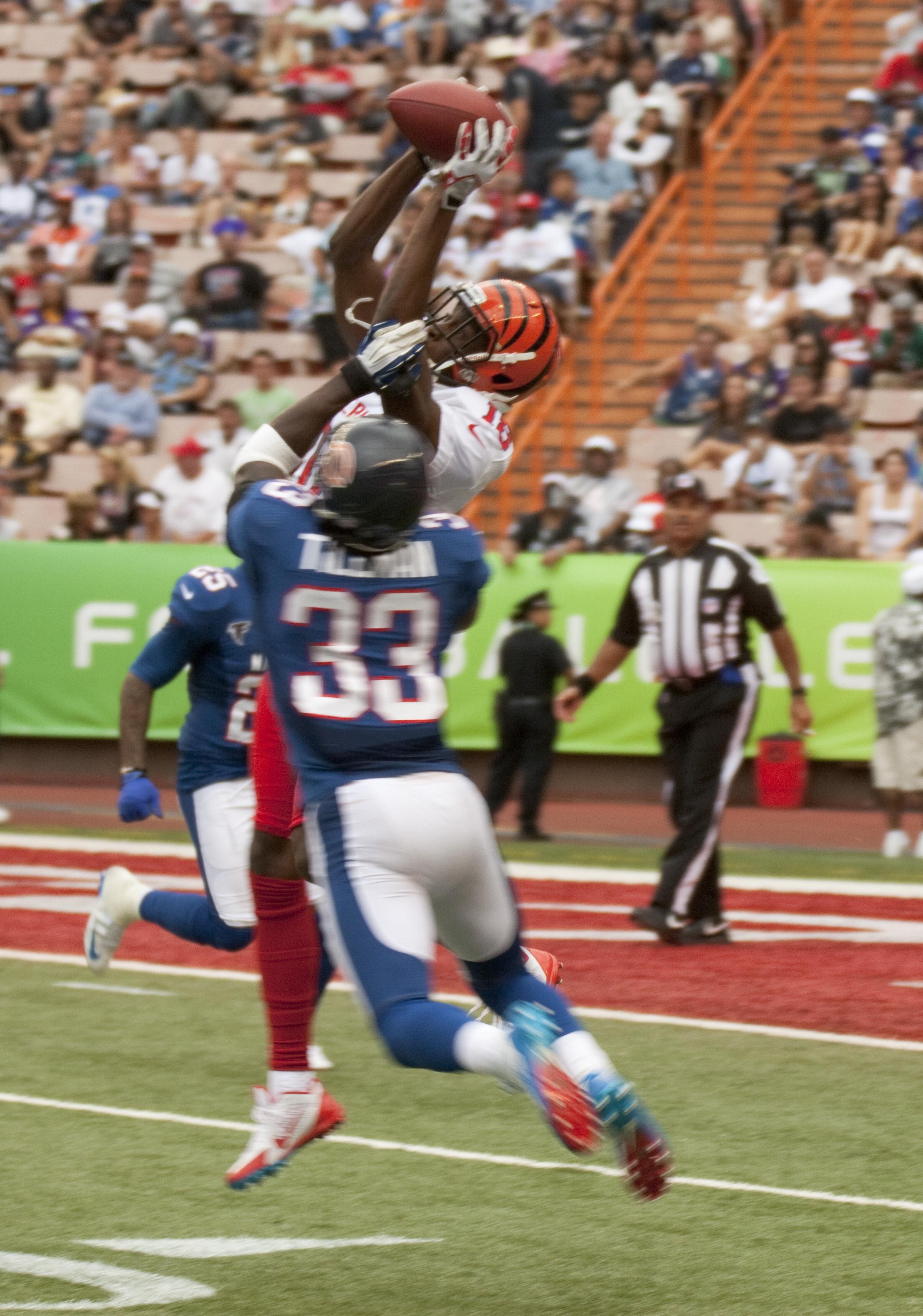 A.J. Green reaches for a pass while Charles Tillman defends during the 2013 Pro Bowl.