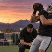 An anonymous tight end makes a catch during a desert practice