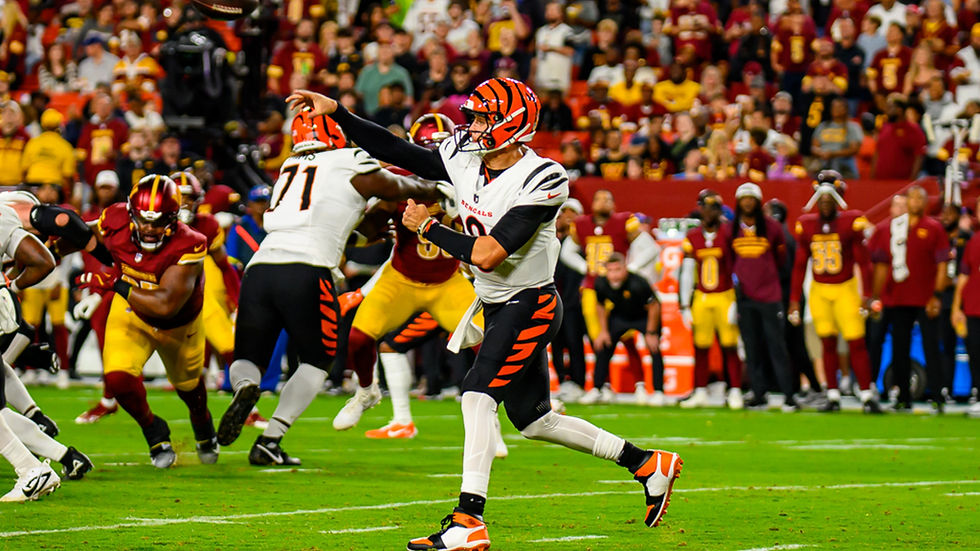 Joe Burrow throws a pass in a white Cincinnati Bengals No. 9 uniform during the August 18, 2025 preseason game at Washington.