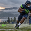 An anonymous running back practices in rain ahead of a possible return