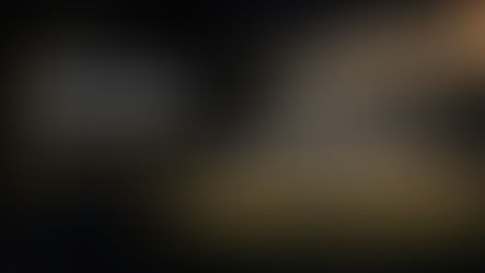 AI-assisted Football Nation illustration of an anonymous quarterback standing behind five blockers inside a gold-outlined tackle box.