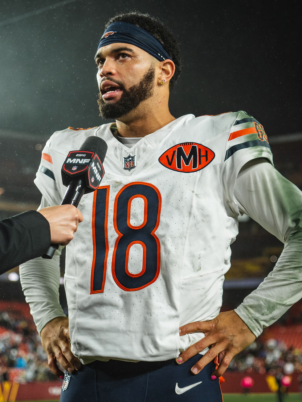 Caleb Williams in his white Chicago Bears No. 18 uniform during a postgame interview in October 2025.