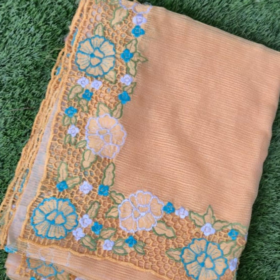 Lightweight Kota saree in orange hue displayed with cutwork detail