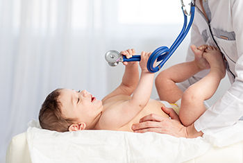 Baby Under Pediatric Examination